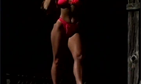 Very popular and sexy 6'1" 175 pound bodybuilder plays with Her sword. She is wearing a bikini and in High heels then takes them off.