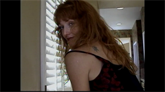 A video by Rick Dobbins. STANSIE, a tall, redheaded kickboxer/ wrestler, with long toned legs and great calves, poses and walks up and down stairs, then poses with and climbs a ladder.