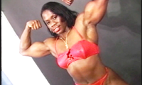 Bodybuilder SHEILA, a long, tall Texan with full, round muscles, great shoulders and sparkling eyes, presents her terrific proportions, first in a backless one-piece, then in a red bikini, as she dances through a power-packed posing routine.