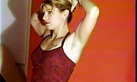 An extended lift session with the tall blond Amazon, Ostara. Her opening words are "I'm going to pick you up and carry you around!" She says it with great conviction and then proceeds to show her power by carrying a guy in her arms like a baby. Switching into a beautiful red dress, she does some muscle posing, showing off her firm, shapely arms, and her incredible legs, complete with a giant tattoo which you'll have to see to believe. Other great lifts follow, including front straddles, piggybacks, cradle carries, shoulder lifts and more. This girl is beautiful, fit, and very, very strong.