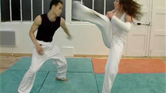 The stuntwoman is training in the dojo when the stuntman interrupts claiming the place. She defies him. This video contains a great fighting scene shot from different angles.
